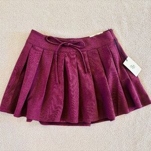 pleated mini skirt